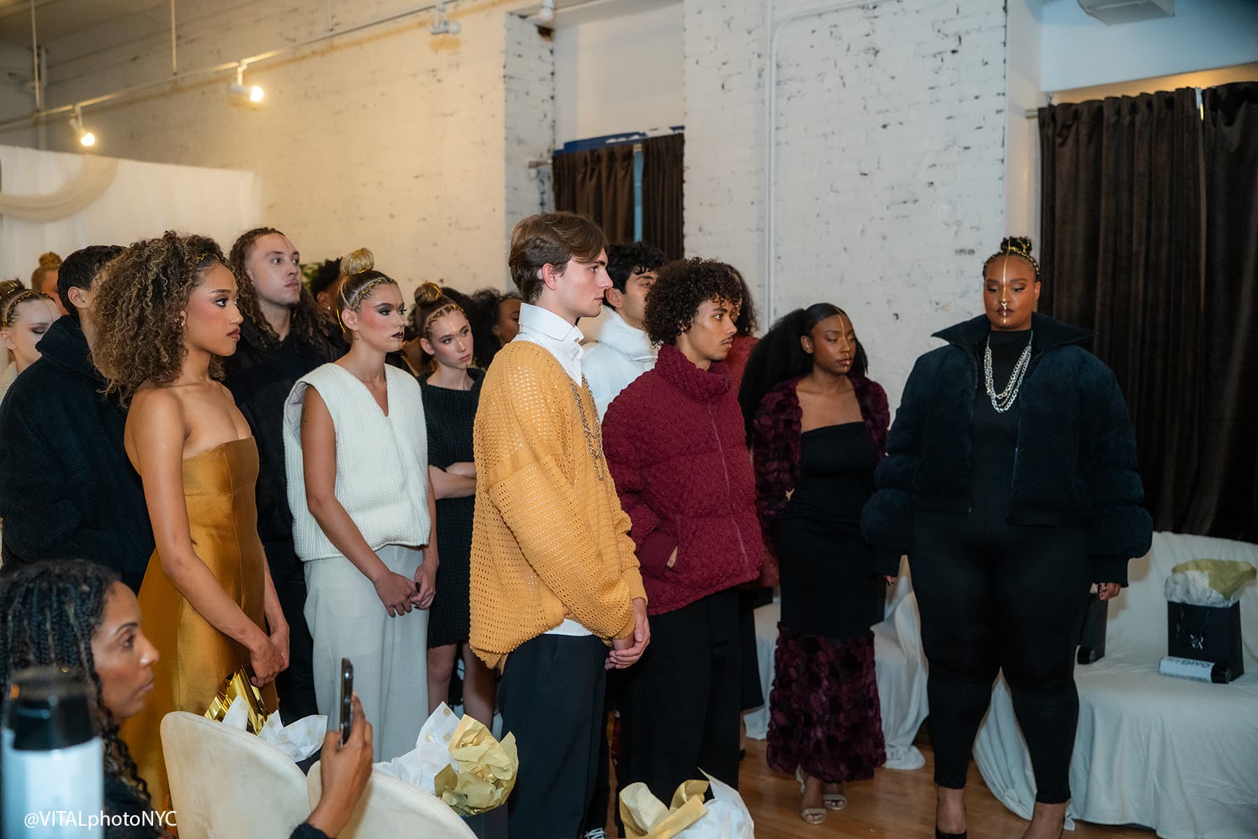 The cast lined up in their looks before the Between Worlds show