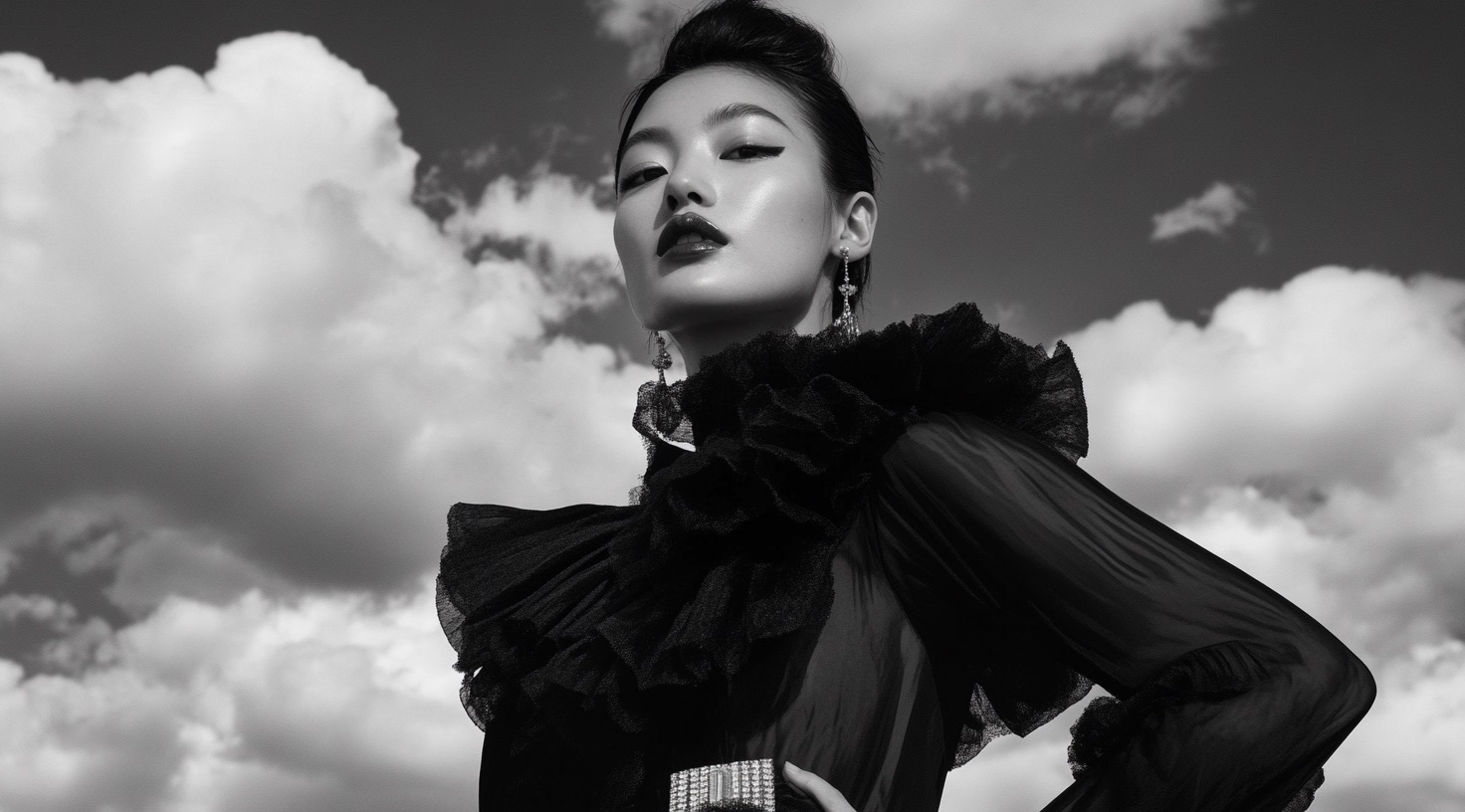 Black sculptural outerwear in a fashion editorial landscape