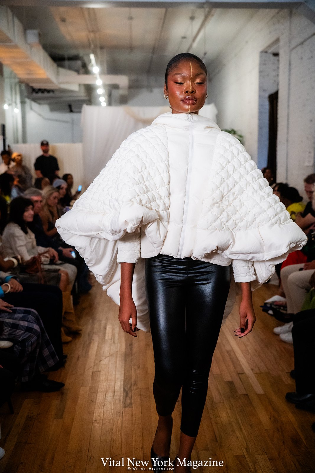 The Phoenix Cape in white, photographed on the Between Worlds runway at New York Fashion Week